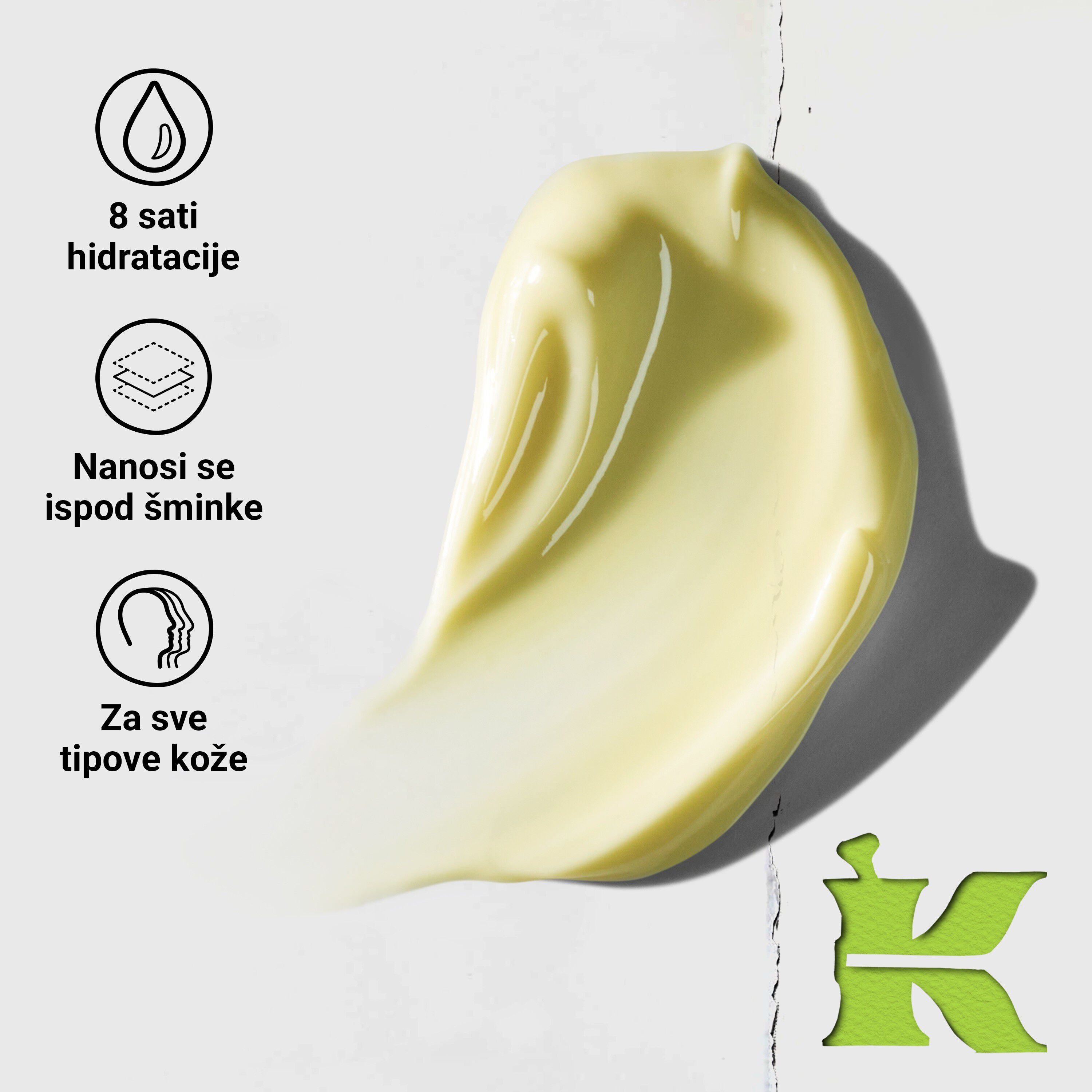 Model koji namiguje s posudicom Kiehl's Creamy Eye Treatment with Avocado koja prekriva jedno oko