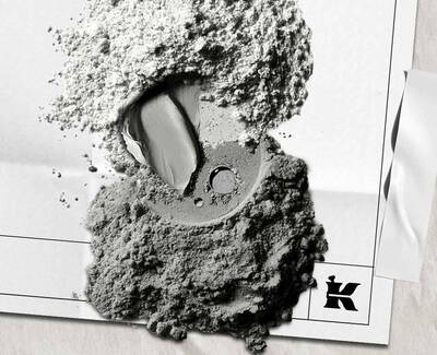 A close-up image of a textured white surface with varying shades and levels of detail, showcasing cracks and uneven areas.