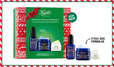 A festive gift box featuring Kiehl's Nighttime Hydration Essentials, including three full-size skincare products: Midnight Recovery Concentrate, Ultra Facial Cream, and Creamy Eye Treatment with Avocado. The box is adorned with a bright holiday design.