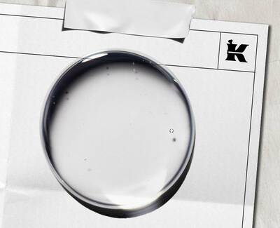 A close-up view of a translucent crystal structure, showcasing intricate lines and patterns within its facets. The background is softly blurred, highlighting the crystal's detail and texture.