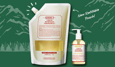 An image showcasing Kiehl's Grapefruit Liquid Hand Soap in two forms: a pump bottle and a new refillable pouch, with a nature-themed background and the text "New Refillable Pouch."